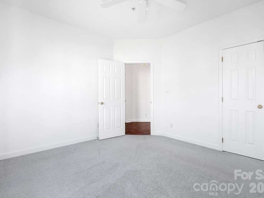 18816 Nautical Drive, Cornelius, NC 28031.  MLS# CAR4321844, YatesRealty ID 2405. Bedroom 2 of 3. Seller giving $15,000 flooring allowance! Carpet virtually enhanced.