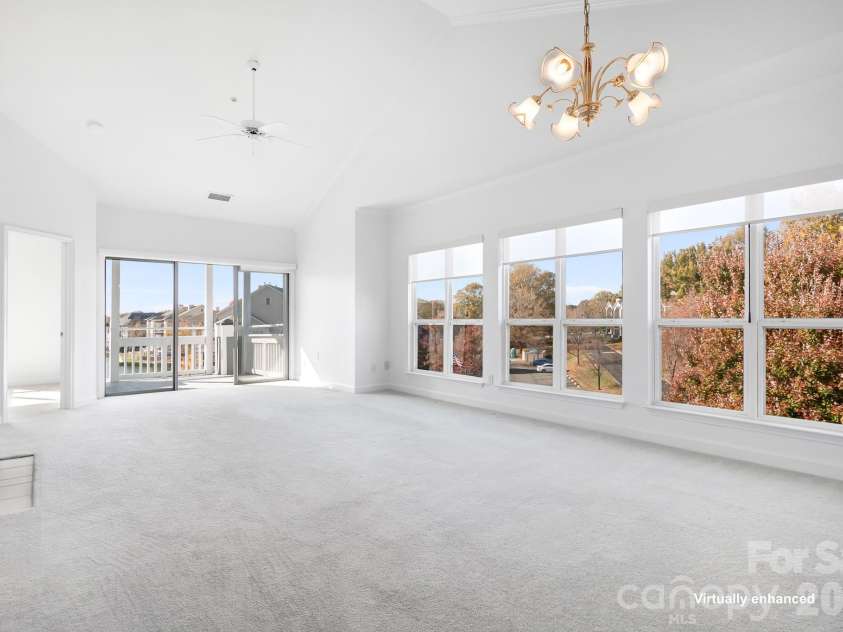 18816 Nautical Drive, Cornelius, NC 28031.  MLS# CAR4321844, YatesRealty ID 2405. End Unit! Wall of Windows! Seller giving $15,000 flooring allowance! Carpet virtually enhanced.