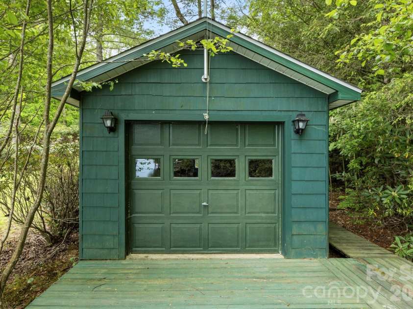 1592 Eagle Lake Drive, Brevard, NC 28712.  MLS# CAR4384665, YatesRealty ID 24052. Boathouse