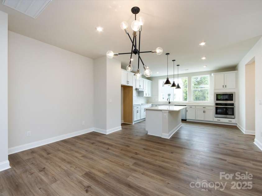 7944 Cedarsmith Court, Charlotte, NC 28217.  MLS# CAR4215191, YatesRealty ID 24064. Designer Light Fixture Over Dining Space.