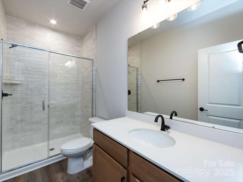 7944 Cedarsmith Court, Charlotte, NC 28217.  MLS# CAR4215191, YatesRealty ID 24064. First Floor Full Bath with Upgraded Walk-In Shower.