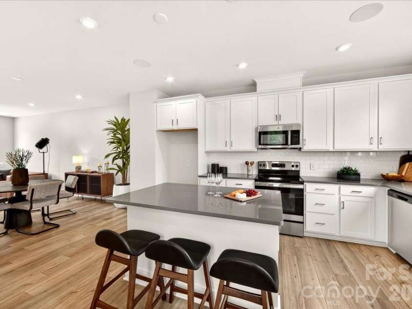 4032 Canvas Court, Charlotte, NC 28205.  MLS# CAR4384752, YatesRealty ID 24070. Chef-inspired kitchen with white cabinets