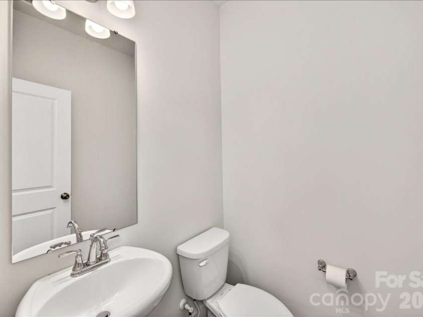 4032 Canvas Court, Charlotte, NC 28205.  MLS# CAR4384752, YatesRealty ID 24070. Second floor powder room