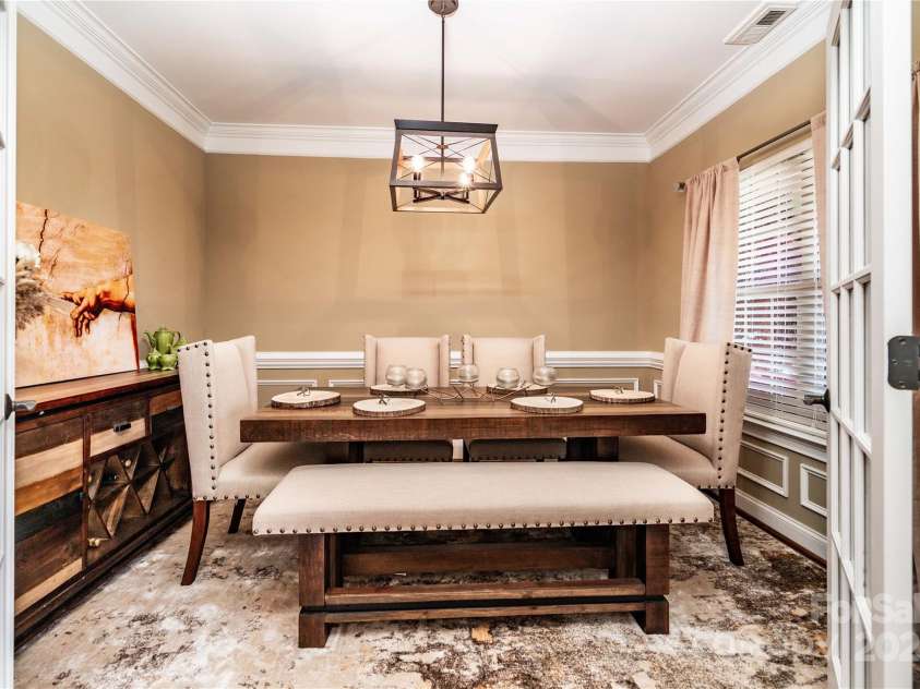 128 Aztec Circle, Mooresville, NC 28117.  MLS# CAR4267164, YatesRealty ID 24072. Flex room could be a formal dining room or a nice office with French doors