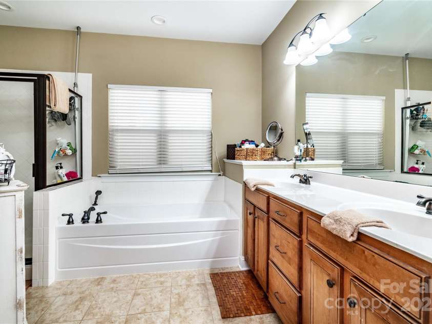 128 Aztec Circle, Mooresville, NC 28117.  MLS# CAR4267164, YatesRealty ID 24072. Primary bath with dual sinks, large shower and garden tub