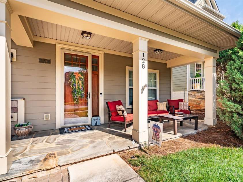 128 Aztec Circle, Mooresville, NC 28117.  MLS# CAR4267164, YatesRealty ID 24072. Relax on the front porch