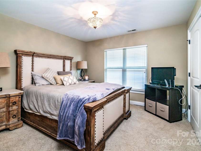128 Aztec Circle, Mooresville, NC 28117.  MLS# CAR4267164, YatesRealty ID 24072. Spacious secondary bedroom upstairs