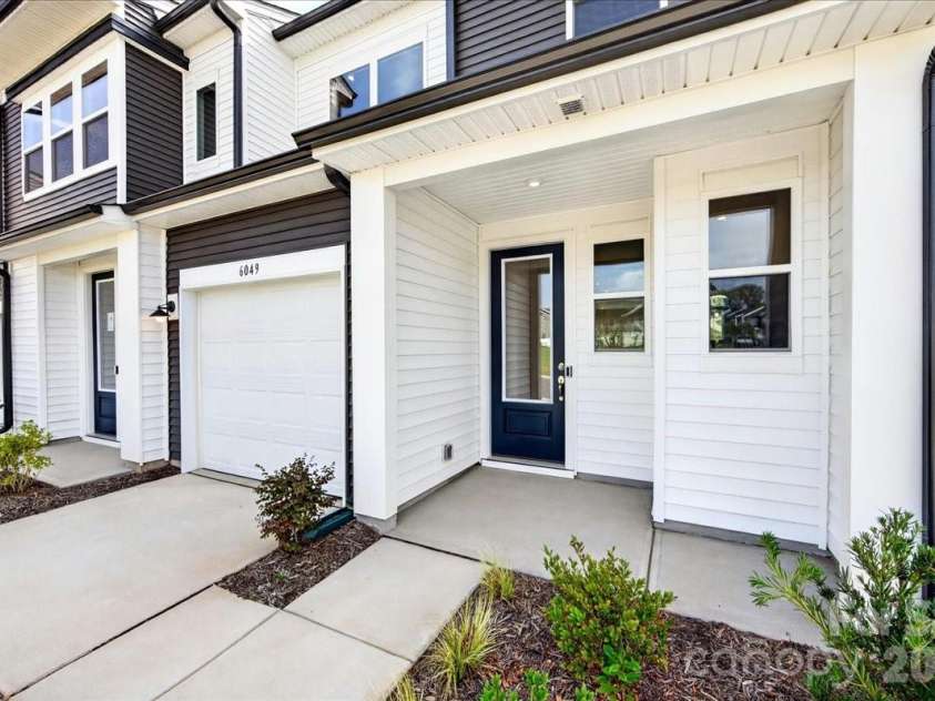 6049 Longar Lane, Charlotte, NC 28269.  MLS# CAR4384836, YatesRealty ID 24079. Covered front porch