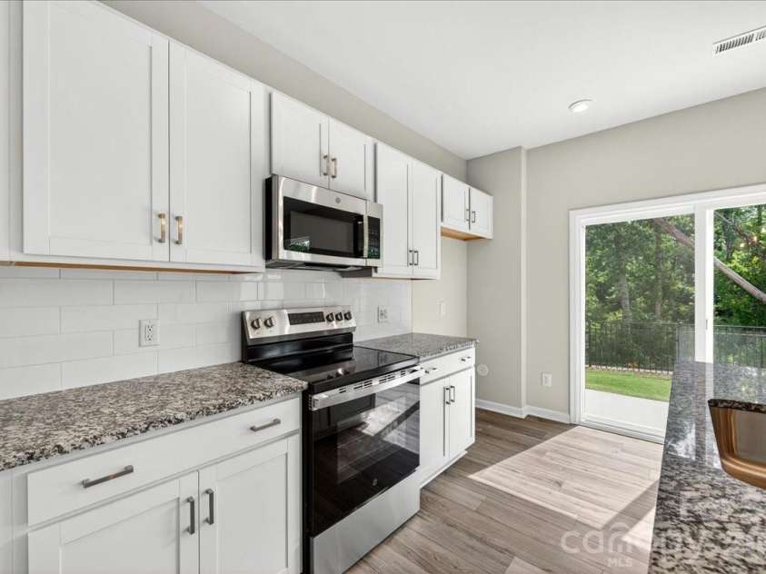 6049 Longar Lane, Charlotte, NC 28269.  MLS# CAR4384836, YatesRealty ID 24079. Electric range, Microwave and dishwasher