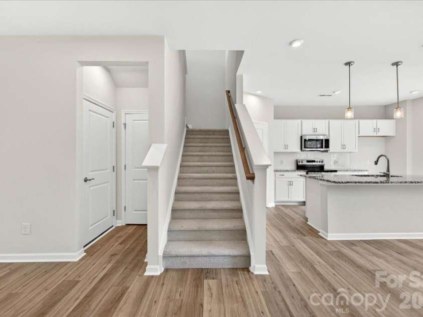 6049 Longar Lane, Charlotte, NC 28269.  MLS# CAR4384836, YatesRealty ID 24079. First floor stairs 