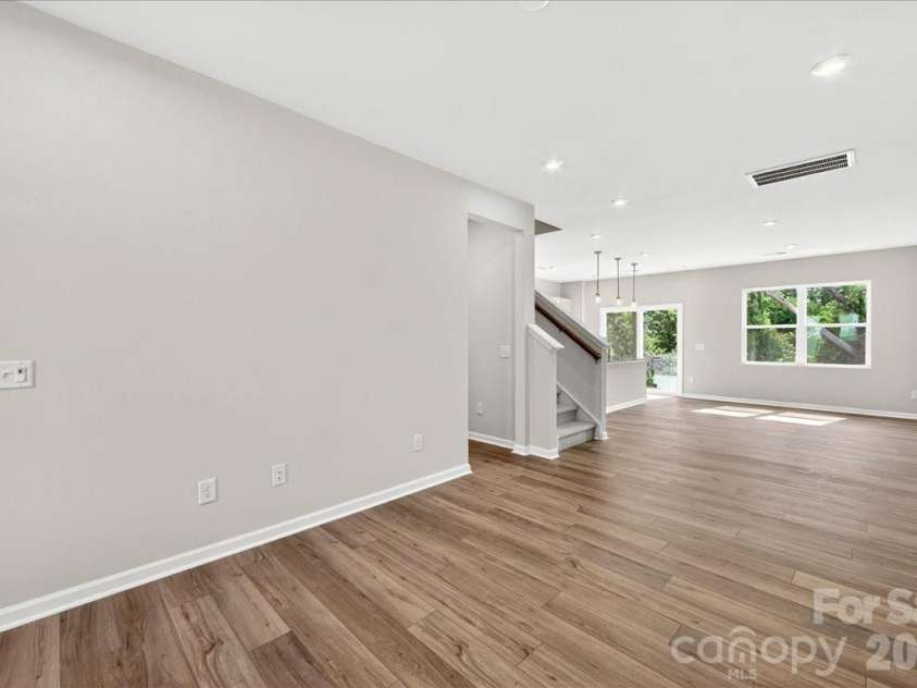 6049 Longar Lane, Charlotte, NC 28269.  MLS# CAR4384836, YatesRealty ID 24079. Light filled first floor 