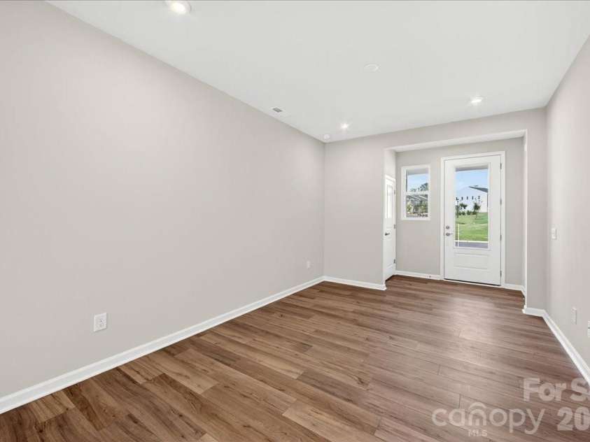 6049 Longar Lane, Charlotte, NC 28269.  MLS# CAR4384836, YatesRealty ID 24079. Living room