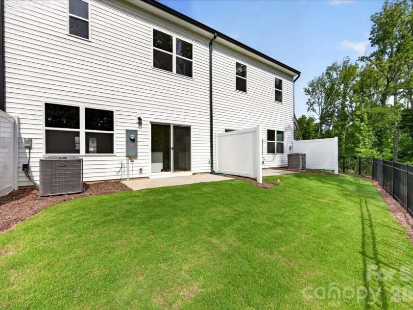 6049 Longar Lane, Charlotte, NC 28269.  MLS# CAR4384836, YatesRealty ID 24079. Outdoor living with tree-lined views