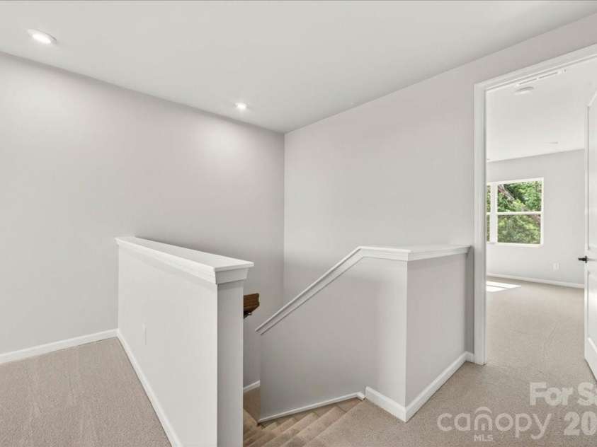 6049 Longar Lane, Charlotte, NC 28269.  MLS# CAR4384836, YatesRealty ID 24079. Second floor landing