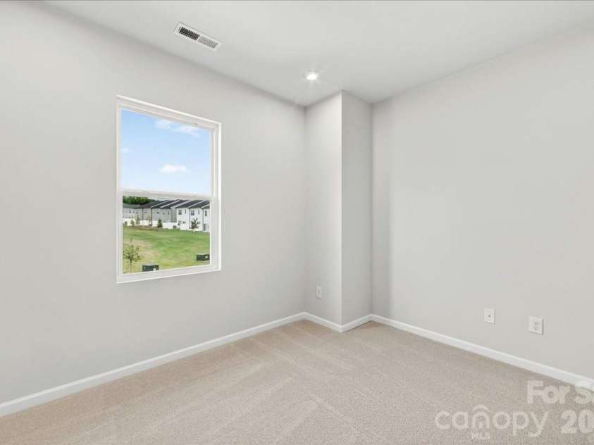 6049 Longar Lane, Charlotte, NC 28269.  MLS# CAR4384836, YatesRealty ID 24079. Secondary bedroom