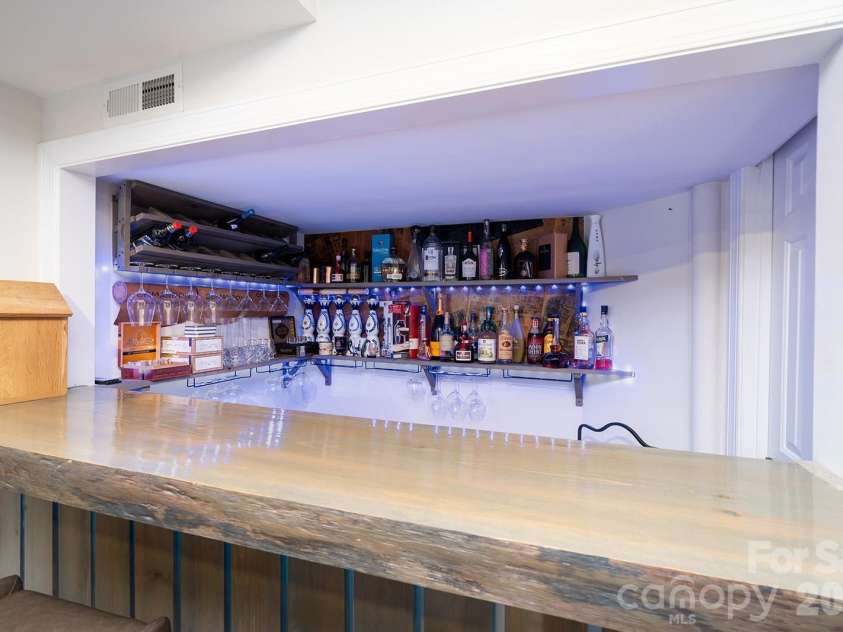 1617 Home Place, Matthews, NC 28105.  MLS# CAR4384540, YatesRealty ID 24083. Basement Bar