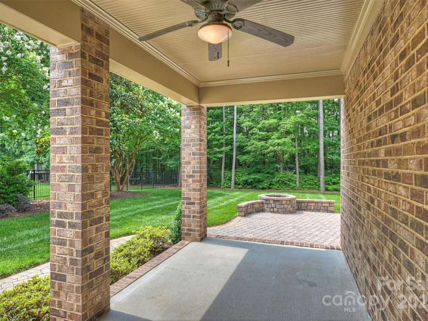 7319 Stonehaven Drive, Waxhaw, NC 28173.  MLS# CAR4266937, YatesRealty ID 24083. Here is the side porch, with a door leading into the great room - yet another place to relax and enjoy the outdoors!