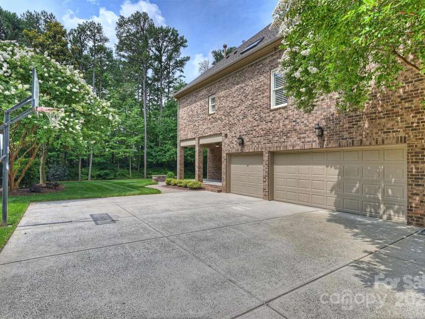 7319 Stonehaven Drive, Waxhaw, NC 28173.  MLS# CAR4266937, YatesRealty ID 24083. Large, freshly-power washed driveway leading to the 3-car garage.