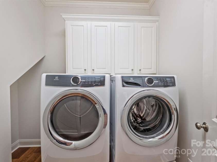 7319 Stonehaven Drive, Waxhaw, NC 28173.  MLS# CAR4266937, YatesRealty ID 24083. Upper level laundry room is very convenient - no stairs to climb with heavy laundry baskets!  The washer and dryer convey to the new owners.