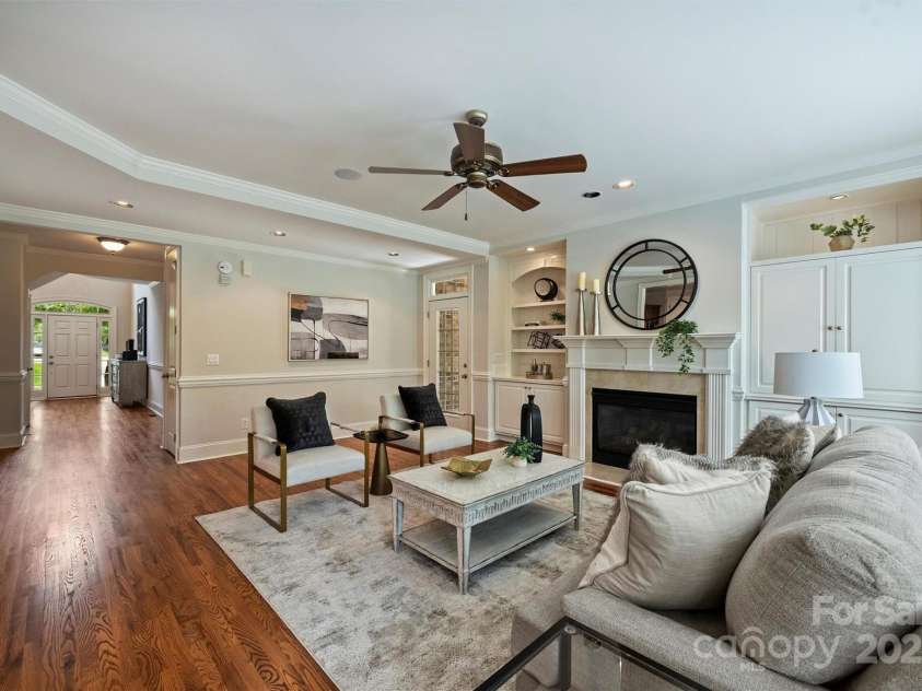 7319 Stonehaven Drive, Waxhaw, NC 28173.  MLS# CAR4266937, YatesRealty ID 24083. View from the great room to the front door.  A half bathroom is on the left.  The wide hallway gives the main level a very spacious feel.