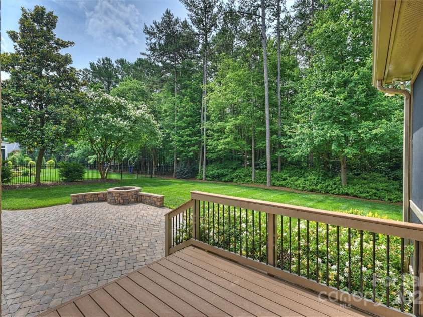 7319 Stonehaven Drive, Waxhaw, NC 28173.  MLS# CAR4266937, YatesRealty ID 24083. View of the trex deck leading to the paver patio and firepit.