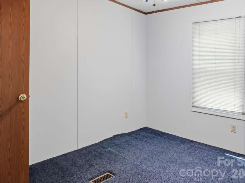 25 Glenn Lance Lane, Fairview, NC 28730.  MLS# CAR4384407, YatesRealty ID 24086. Bedroom