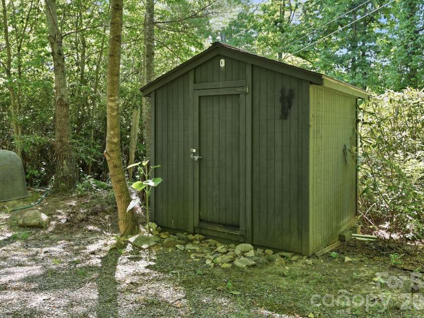 25 Glenn Lance Lane, Fairview, NC 28730.  MLS# CAR4384407, YatesRealty ID 24086. Outbuilding next to Well 