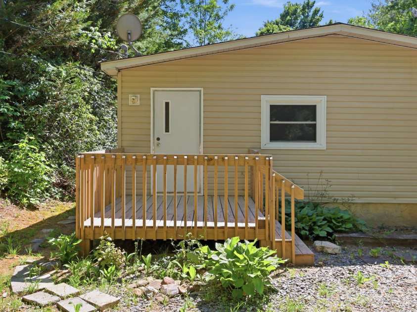 25 Glenn Lance Lane, Fairview, NC 28730.  MLS# CAR4384407, YatesRealty ID 24086. Side Deck Entrance