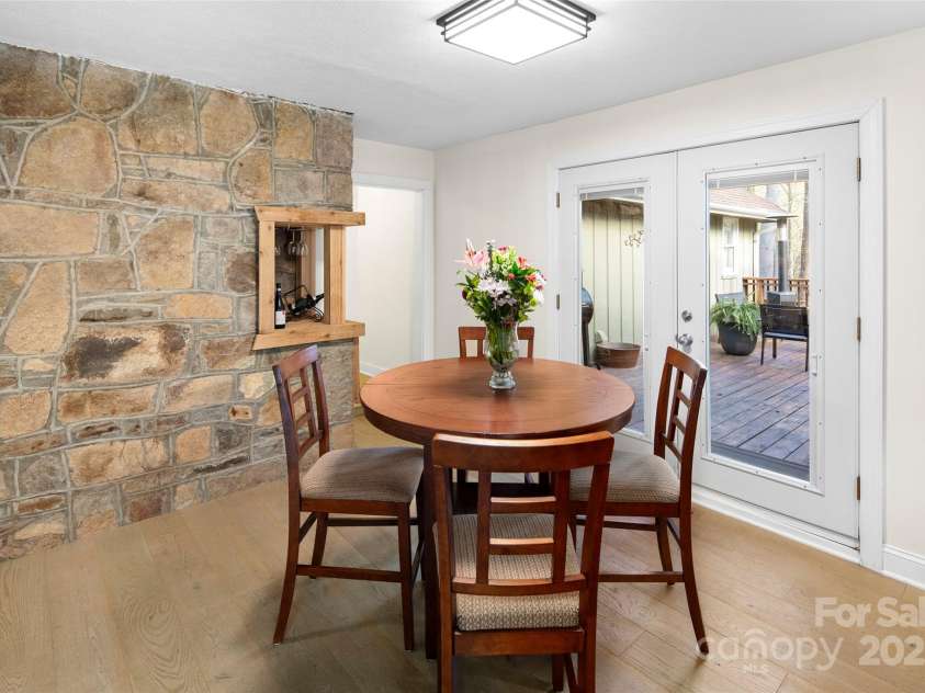 4075 Little River Road, Hendersonville, NC 28739.  MLS# CAR4243668, YatesRealty ID 24087. Dining room with French doors to oversized partially covered deck