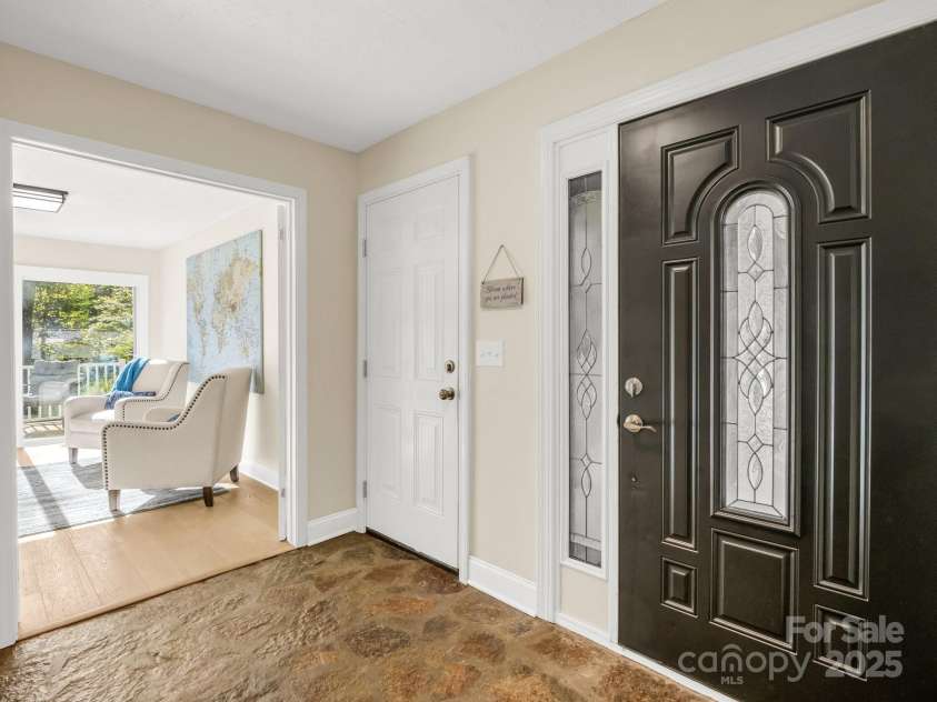 4075 Little River Road, Hendersonville, NC 28739.  MLS# CAR4243668, YatesRealty ID 24087. Gorgeous stone floored foyer at main entrance