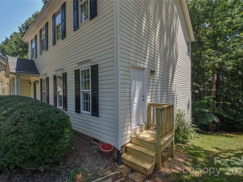 8510 Glade Court, Huntersville, NC 28078.  MLS# CAR4275837, YatesRealty ID 24089. Separate side entry to In- Law suite. New deck and door.