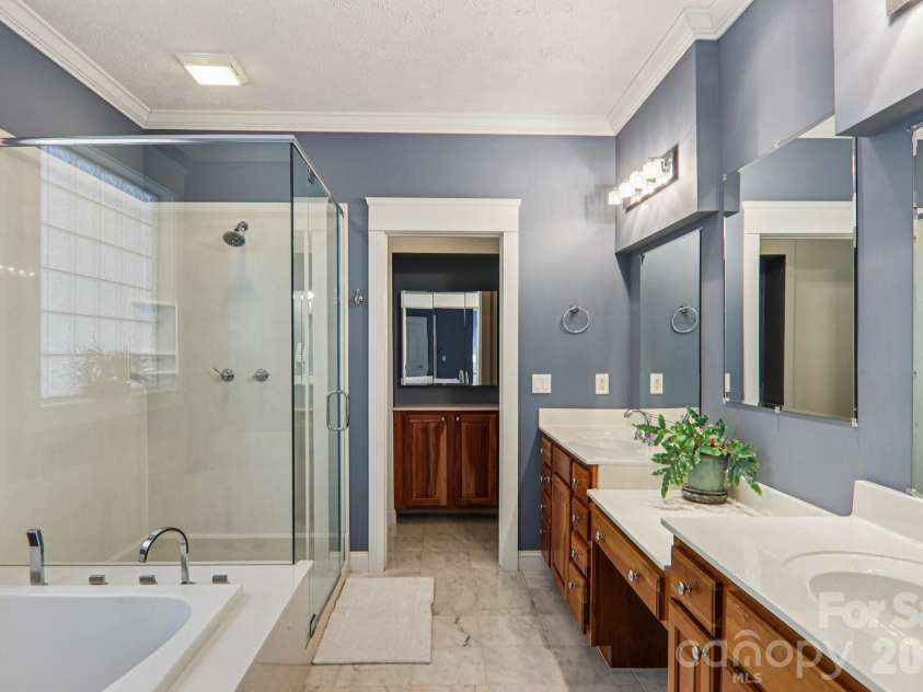 209 Rowland Drive, Laurel Park, NC 28739.  MLS# CAR4348901, YatesRealty ID 2409. A private and spa-like bath designed for comfort and convenience.
