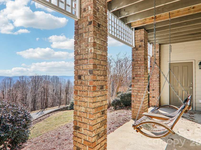 209 Rowland Drive, Laurel Park, NC 28739.  MLS# CAR4348901, YatesRealty ID 2409. Step outside from your office space to enjoy the long-range views