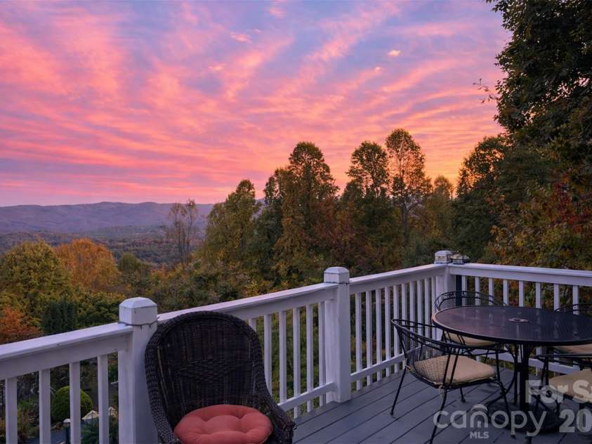 209 Rowland Drive, Laurel Park, NC 28739.  MLS# CAR4348901, YatesRealty ID 2409. Sweeping ridgeline views stretch for miles beyond the home’s elevated lot.