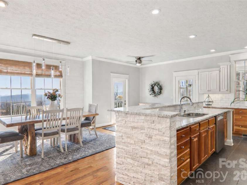 209 Rowland Drive, Laurel Park, NC 28739.  MLS# CAR4348901, YatesRealty ID 2409. The updated kitchen blends function and style — ready for weeknight dinners or hosting friends.