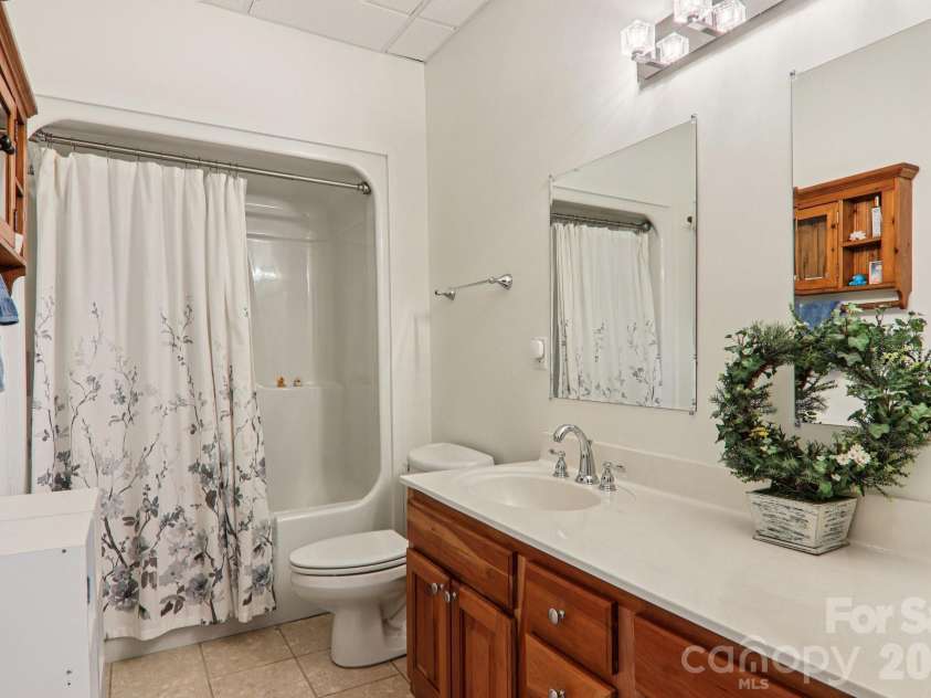 209 Rowland Drive, Laurel Park, NC 28739.  MLS# CAR4348901, YatesRealty ID 2409. Well-appointed full bath for guests and everyday use.