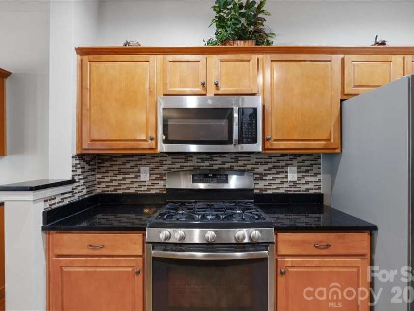 4209 Piccadilly Lane, Fort Mill, SC 29707.  MLS# CAR4384861, YatesRealty ID 24097. Kitchen Gas Range and Microwave