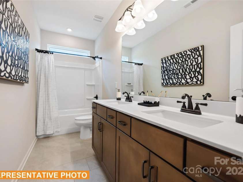 6308 Honor Avenue, Midland, NC 28107.  MLS# CAR4253827, YatesRealty ID 24098. The McGinnis - Hall Bathroom