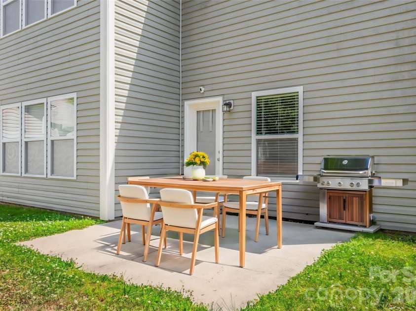 427 Inlet Place Drive, Winston Salem, NC 27127.  MLS# CAR4384907, YatesRealty ID 24101. Patio just outside Kitchen - virtually staged