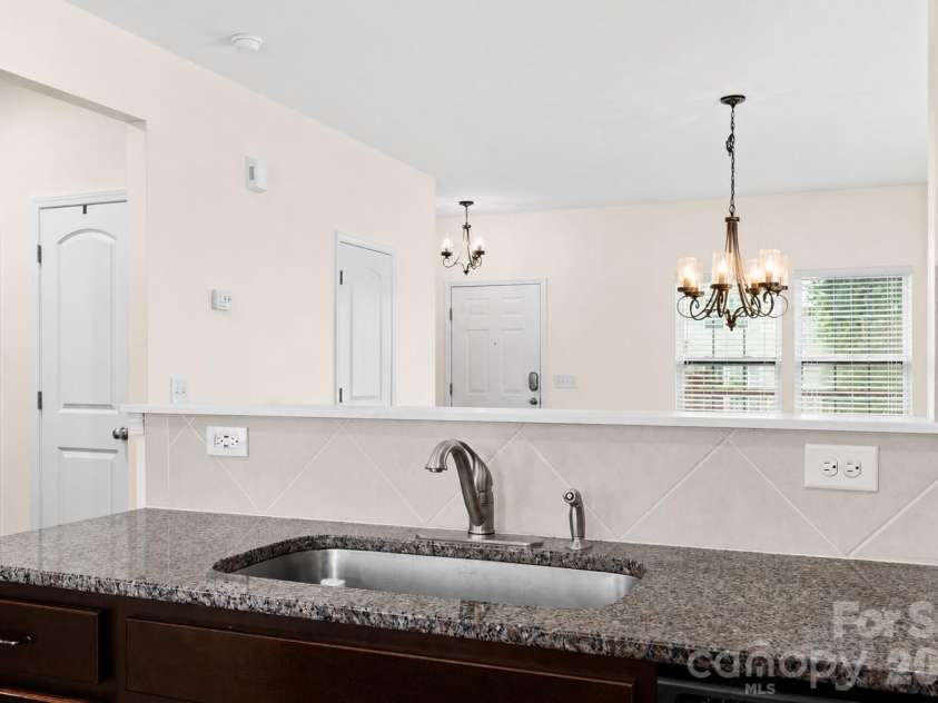 427 Inlet Place Drive, Winston Salem, NC 27127.  MLS# CAR4384907, YatesRealty ID 24101. View from Kitchen into the dining room