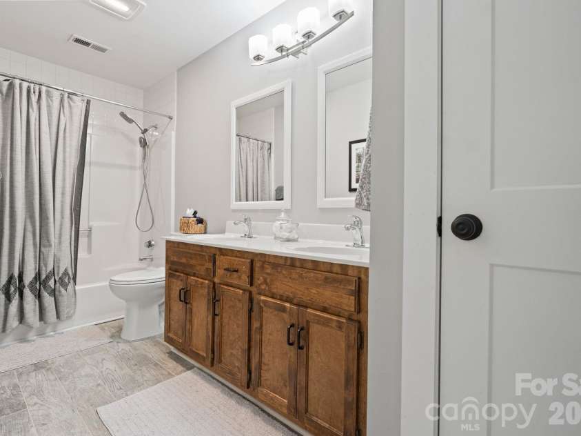 110 Steuben Drive, Huntersville, NC 28078.  MLS# CAR4362724, YatesRealty ID 24105. Second full bathroom with dual vanities and tile floors