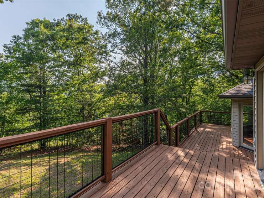 1227 Brush Creek Circle, Fairview, NC 28730.  MLS# CAR4265293, YatesRealty ID 24110. Back deck w/ access to and from primary-suite