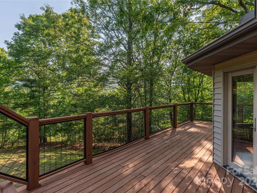 1227 Brush Creek Circle, Fairview, NC 28730.  MLS# CAR4265293, YatesRealty ID 24110. Expansive back deck with winter views