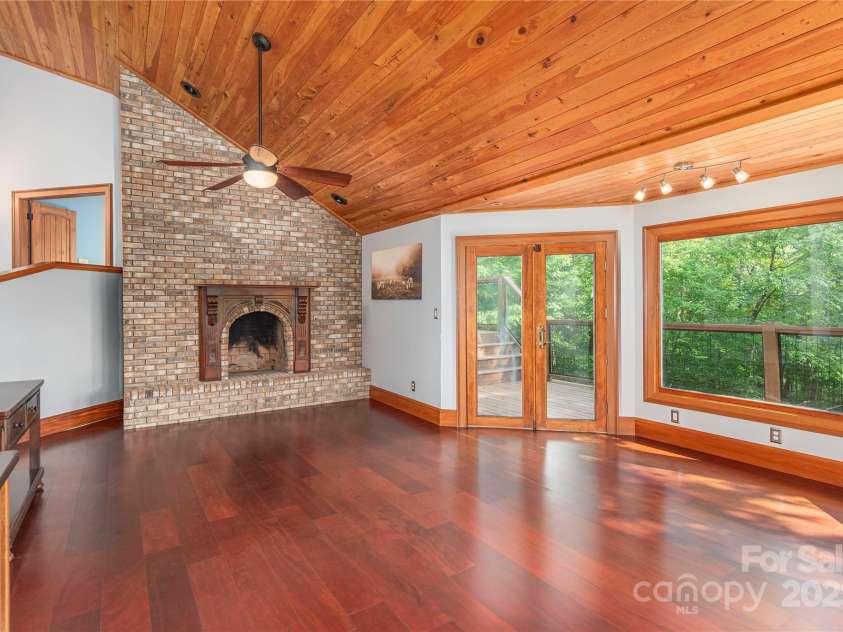 1227 Brush Creek Circle, Fairview, NC 28730.  MLS# CAR4265293, YatesRealty ID 24110. Living area, with access to back deck