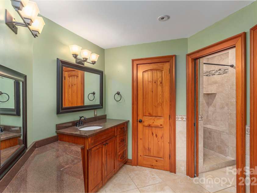 1227 Brush Creek Circle, Fairview, NC 28730.  MLS# CAR4265293, YatesRealty ID 24110. Primary en-suite full bathroom, w/ cedar lined walk-in closet