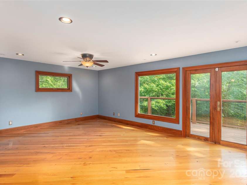 1227 Brush Creek Circle, Fairview, NC 28730.  MLS# CAR4265293, YatesRealty ID 24110. Primary suite w/ Rustic Oak flooring