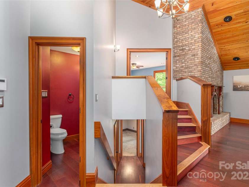 1227 Brush Creek Circle, Fairview, NC 28730.  MLS# CAR4265293, YatesRealty ID 24110. Stairs to primary suite and lower level rooms