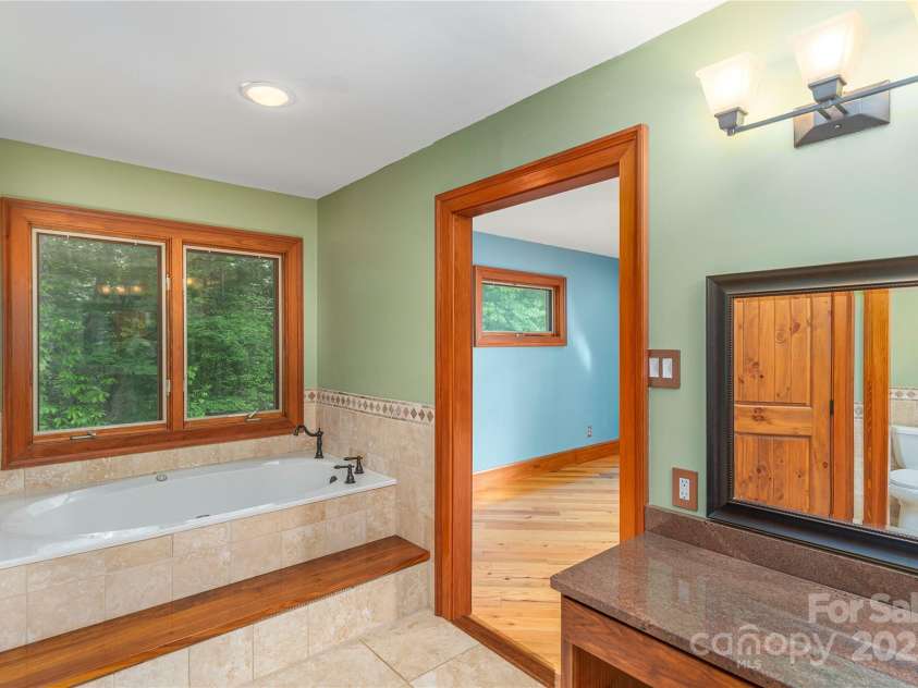 1227 Brush Creek Circle, Fairview, NC 28730.  MLS# CAR4265293, YatesRealty ID 24110. Travertine tile