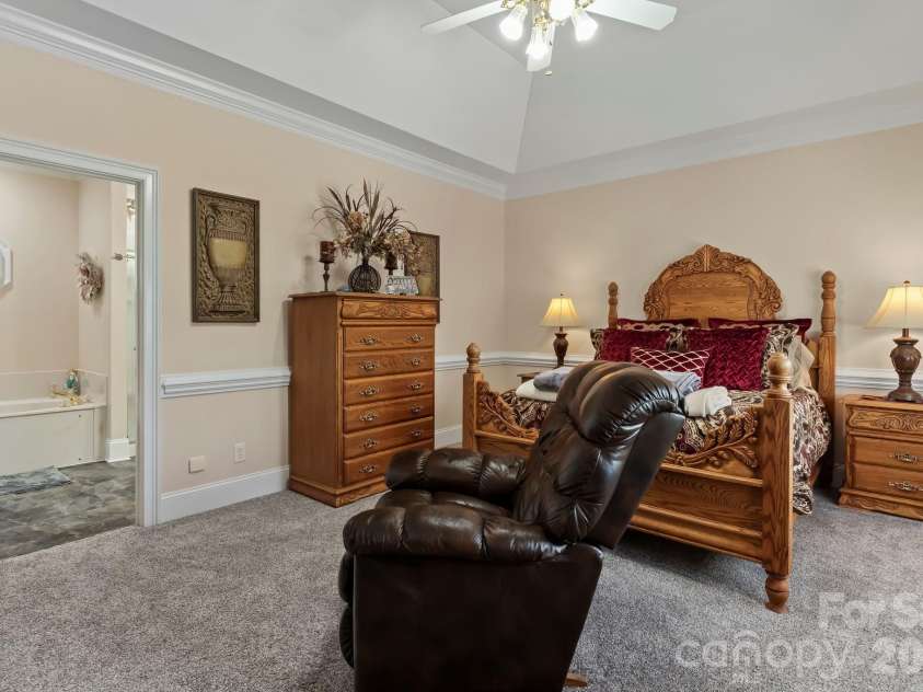 726 Tom Morris Lane, Concord, NC 28027.  MLS# CAR4382168, YatesRealty ID 24111. Main level primary bedroom.