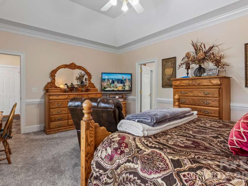 726 Tom Morris Lane, Concord, NC 28027.  MLS# CAR4382168, YatesRealty ID 24111. Main level primary bedroom.